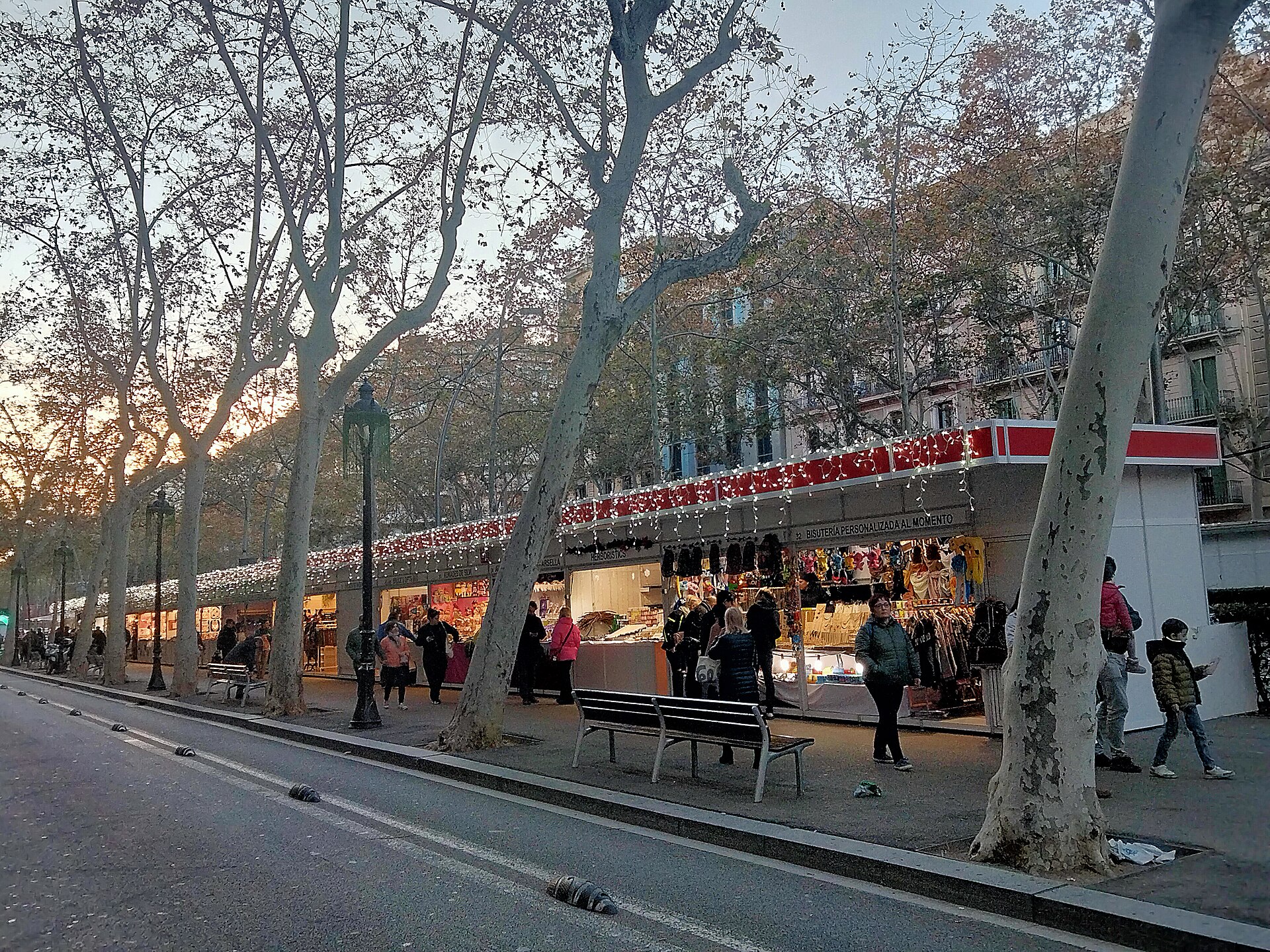 Christmas stalls of the Fira de Reis under the plane trees on Gran Via de les Corts Catalanes, Barcelona